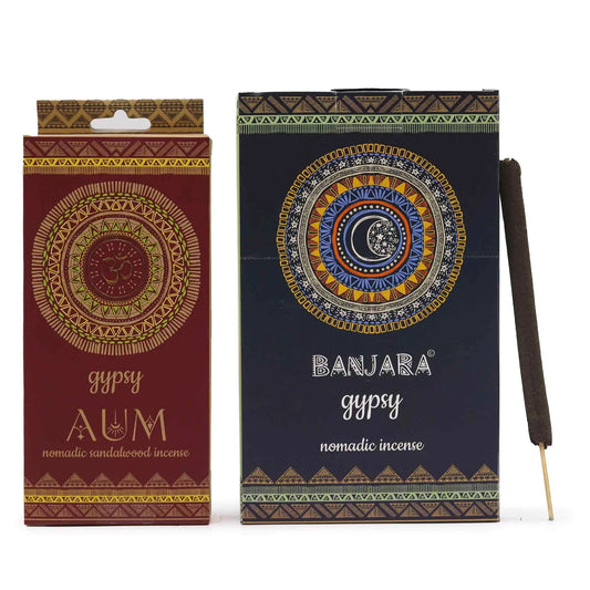 "Gypsy Nomadic Incense AUM sandalwood variety in burgundy packaging with golden Om mandala design, tribal patterns, and natural incense stick displayed alongside"