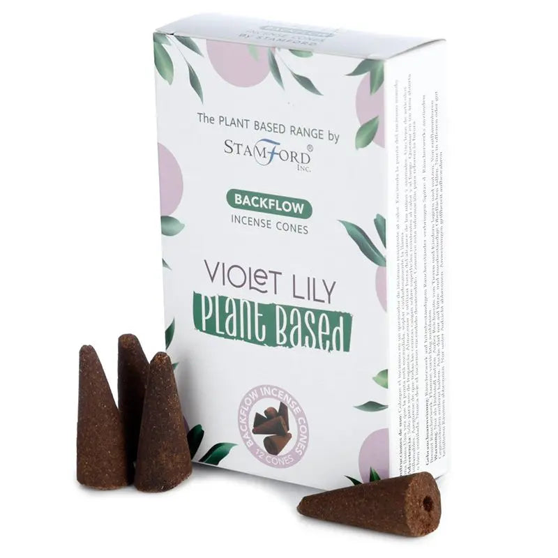 "Plant Based Backflow Incense Cones Violet Lily by Stamford Inc with white botanical packaging featuring soft purple circles and green leaf design, displayed with natural brown backflow incense cones"