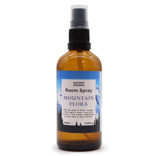 "Mountain Flora Room Spray 100ml Ancient Wisdom amber bottle showing detailed label with winter cyclamen, green apple, honey, freesia, lilac and rose fragrance notes"